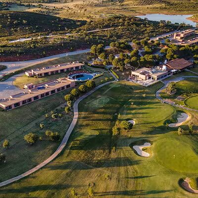 nau-hotels-and-resorts-an-aerial-view-of-a-morgado-golf-course-and-a-resort